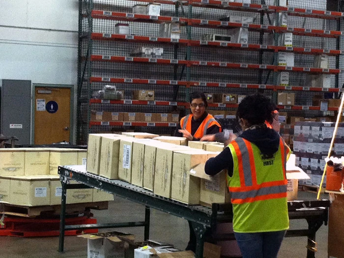 Warehouse associates packing orders